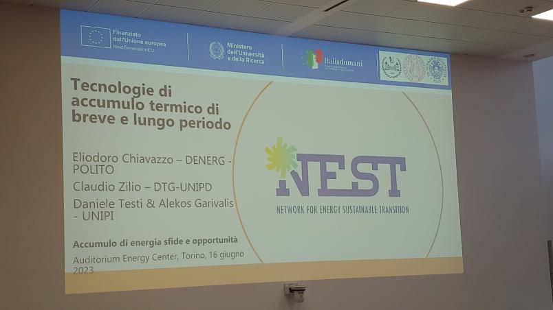 Foto di una slide proiettata in cui viene presentato il progetto NEST