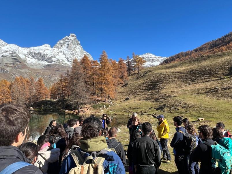 Students, mountains in the background