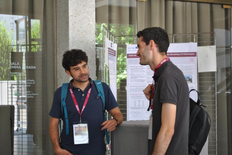 cambio di idee e risultati di ricerca durante la sessione poster della conferenza UIT 2026