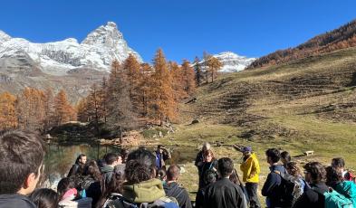 Students, mountains in the background
