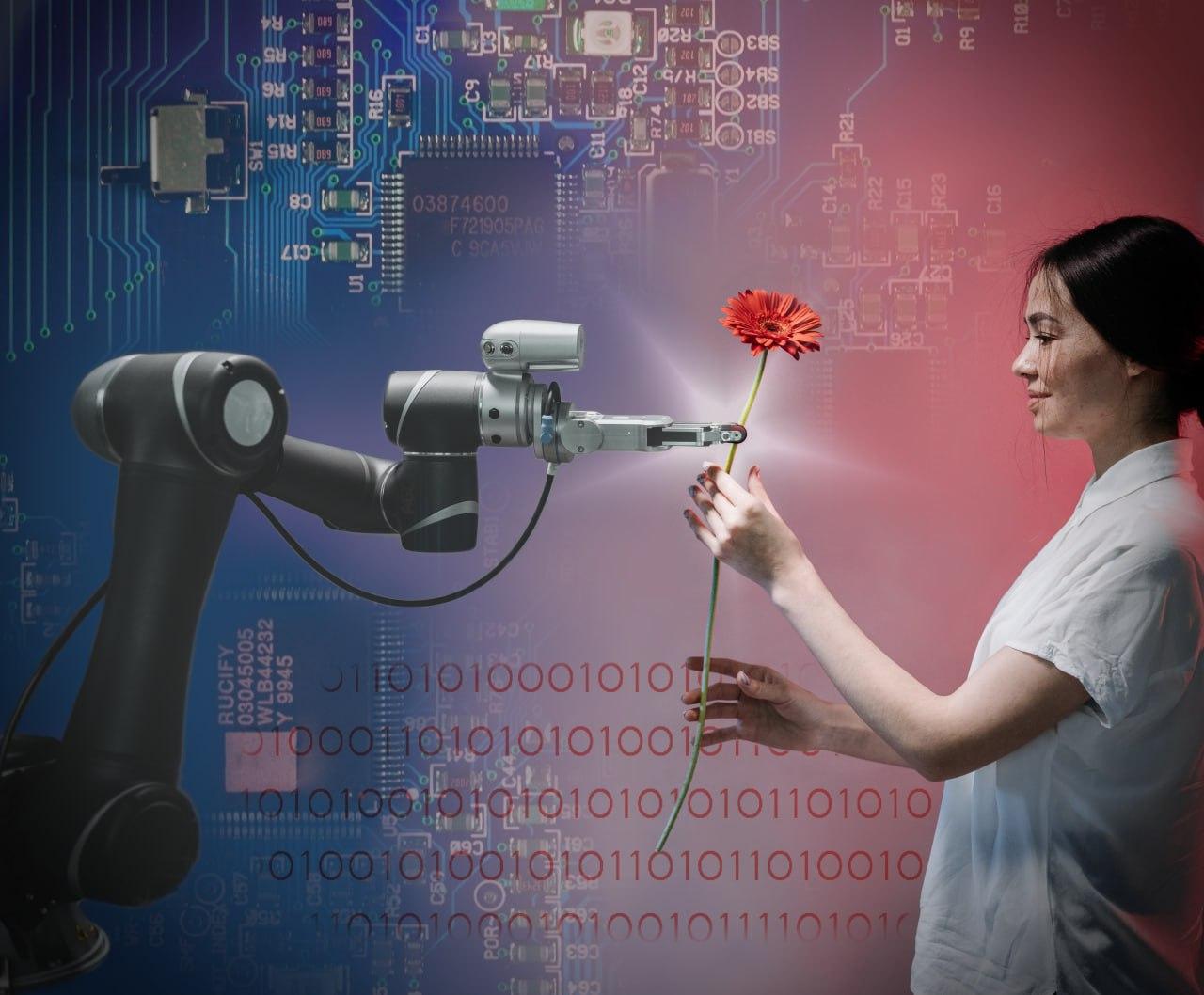 Figura che mostra un braccio robotico controllato elettronicamente che dona un fiore a una ragazza.
